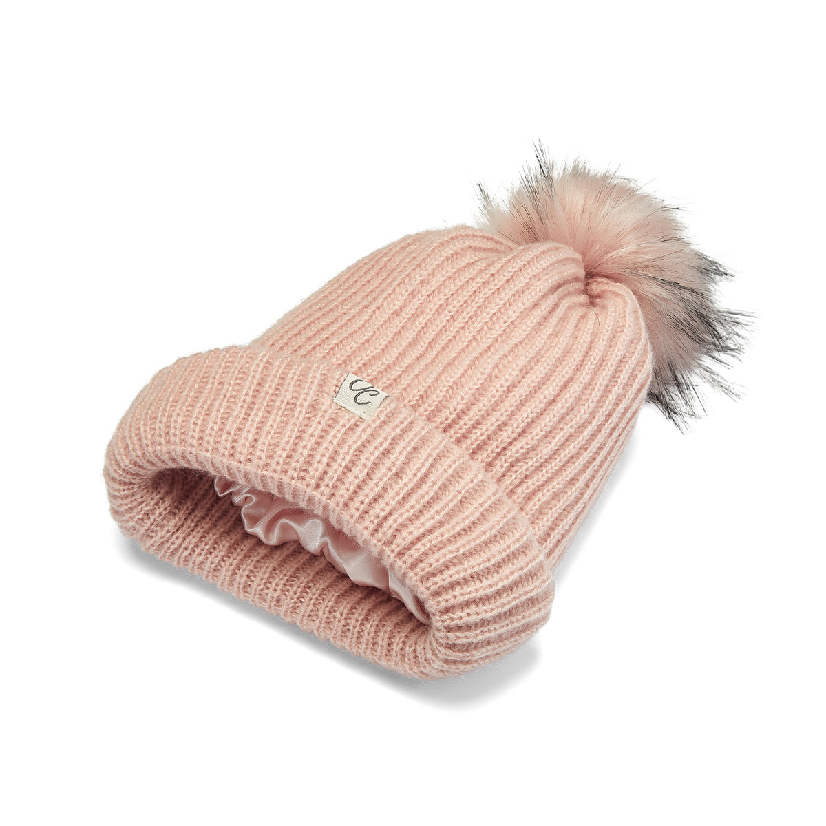 Only Curls Pink Satin Lined Knitted Beanie Hat with pom pom and showing the lining